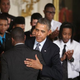 President Obama embraces students from the Chicago's Youth Guidance program Becoming a Man (BAM) after delivering remarks about his 'My Brother's Keeper' initiative in the East Room at the White House February 27, 2014.
Photo by Chip Somodevilla/Getty Images
